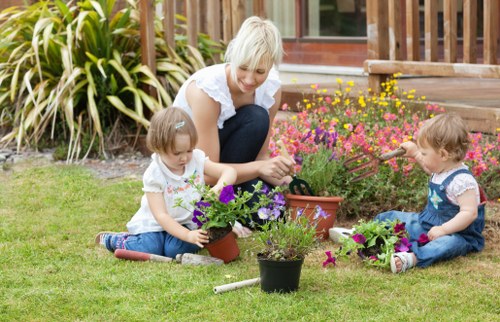 Expert landscaper shaping a hedge in Wood Green