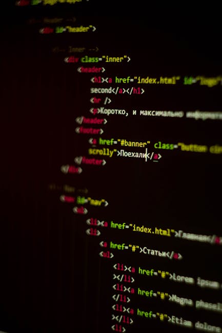 A close-up view of a computer screen displaying colorful lines of programming code with green, blue, orange, and purple text on a black background. The focus is on the screen's content, highlighting t